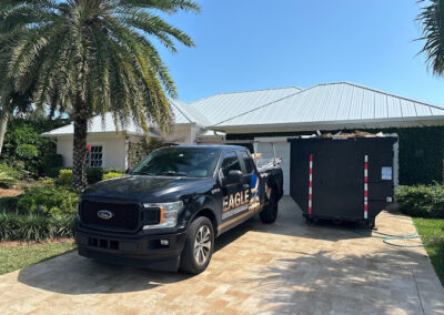 Photo of job site with completed metal roof installation